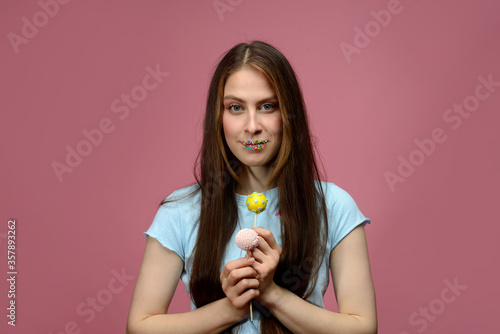 young european woman playes cake pops