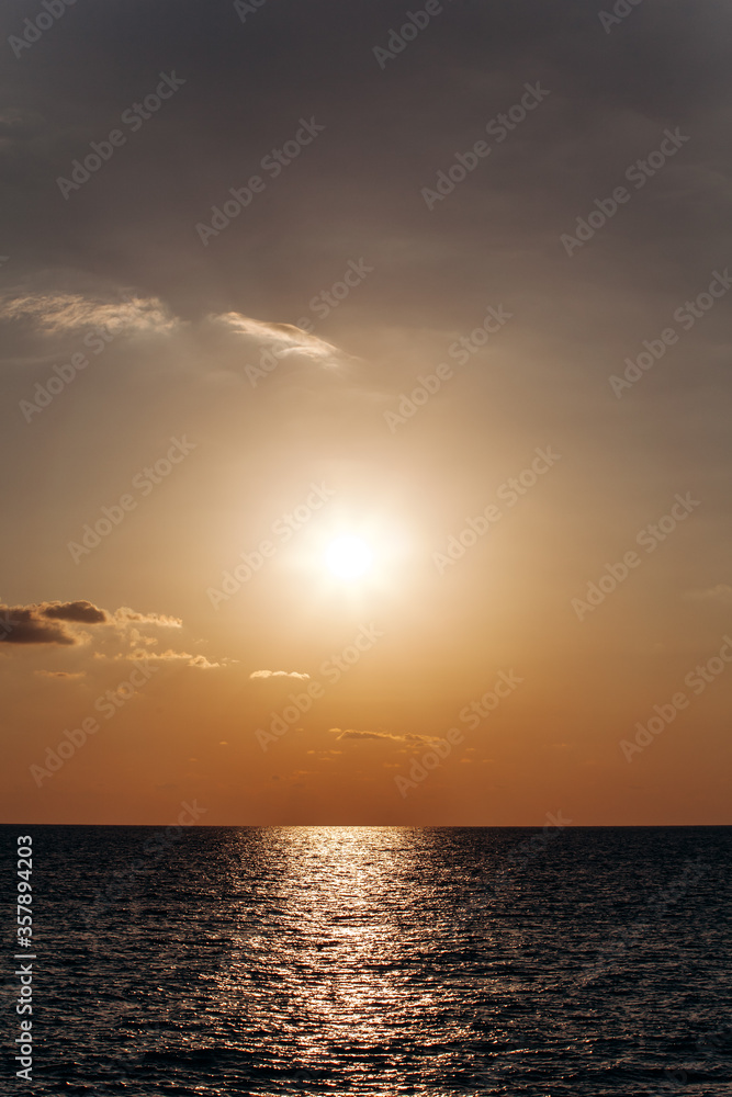 Beautiful warm sunset on the sea. Beautiful scenery. Charming sunset Beautiful warm sunset on the sea. Beautiful scenery. Charming sunset