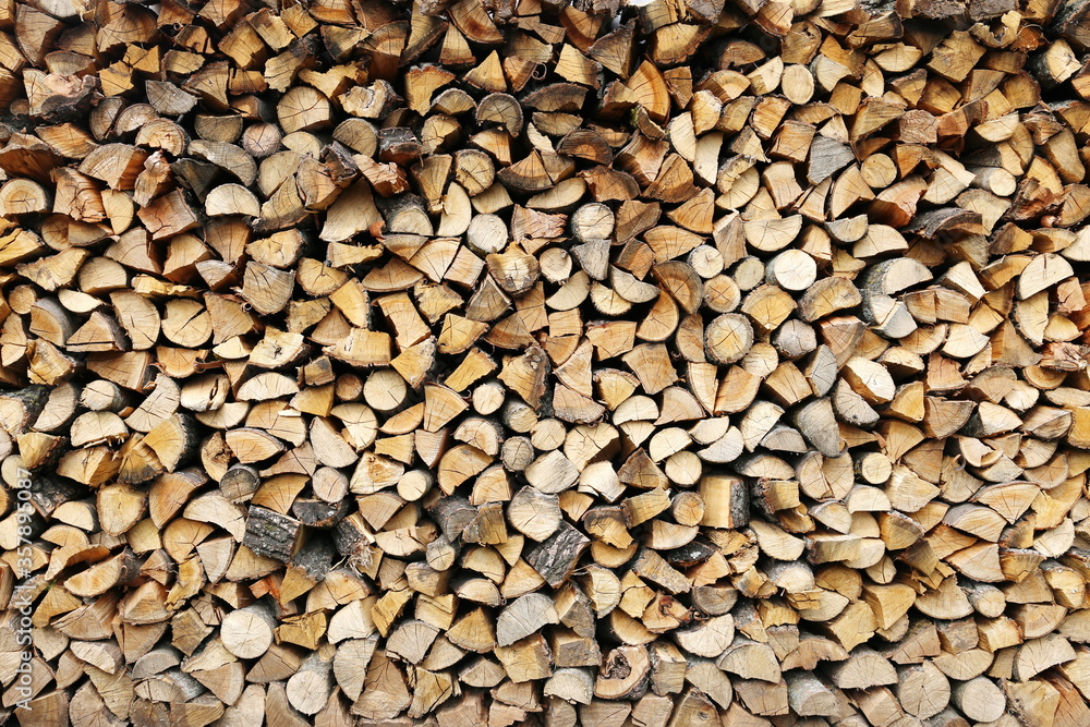 background of carefully stacked chopped firewood