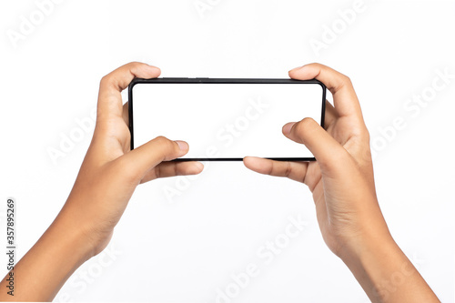 Hands of a woman using a black color smartphone with white space for text isolated on white background