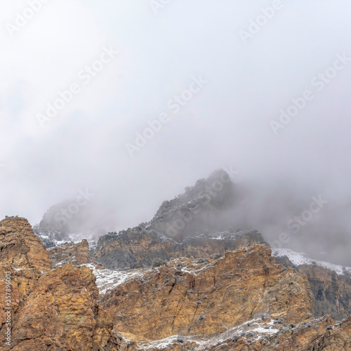 Square crop Misty clouds over the rugged and rocky slope of Provo Canyon mountain in Utah © Jason