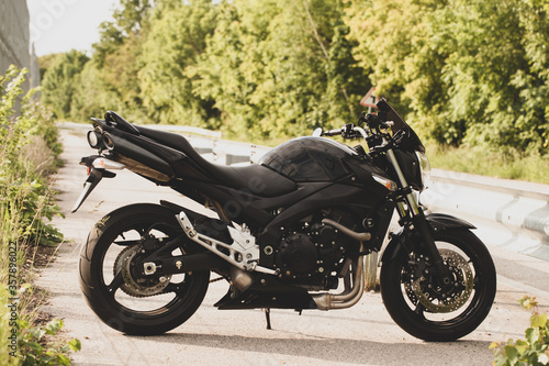 Black motorcycle close-up on the street. © sergeytay