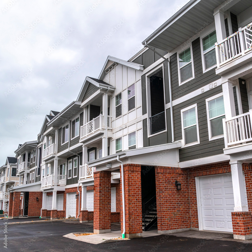 Square Row of new built three story town houses Square Row of new built three story town houses