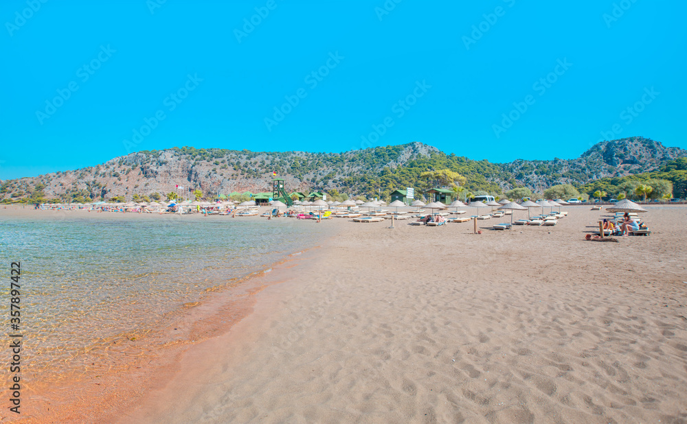 Holidaymakers sunbathing at  Iztuzu beach -  Dalyan, Turkey
