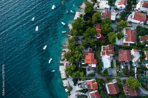 Aerial top down view of a residential neighborhood by the sea