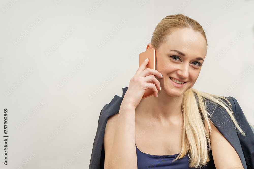 Portrait of beautiful girl talking by smartphone looking at camera in cafe. Portrait of beautiful girl talking by smartphone looking at camera in cafe.