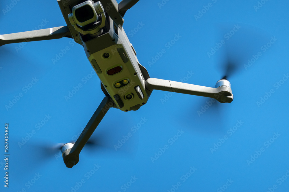 A fragment of the drone in close - up in flight. Focus on the camera. Copy  space. Selective focus. Stock Photo | Adobe Stock