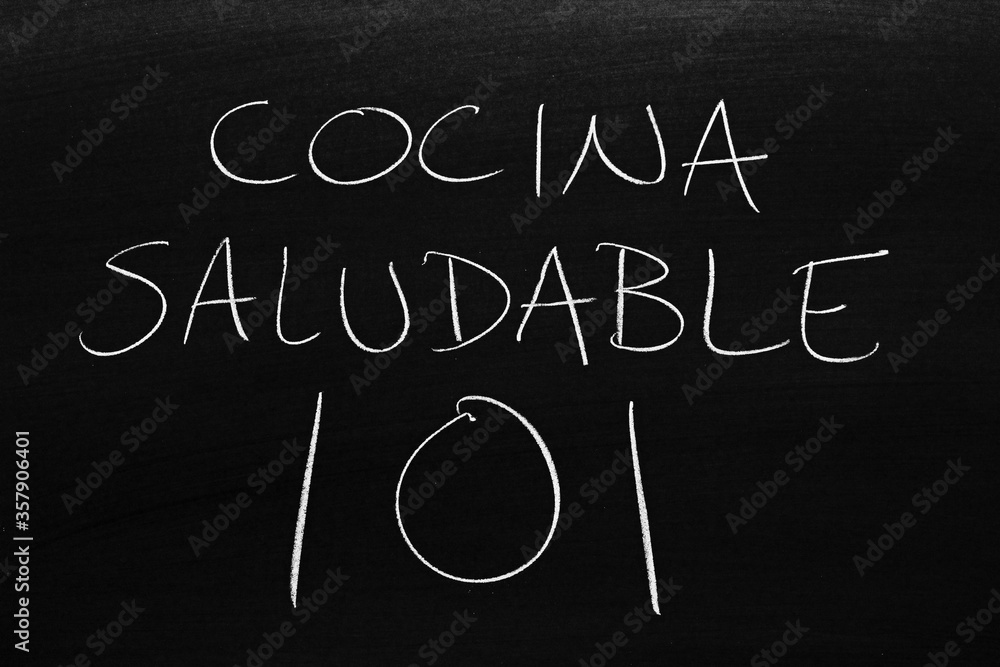 The words Cocina Saludable 101 on a blackboard in chalk. Translation: Healthy Cooking 101 The words Cocina Saludable 101 on a blackboard in chalk. Translation: Healthy Cooking 101