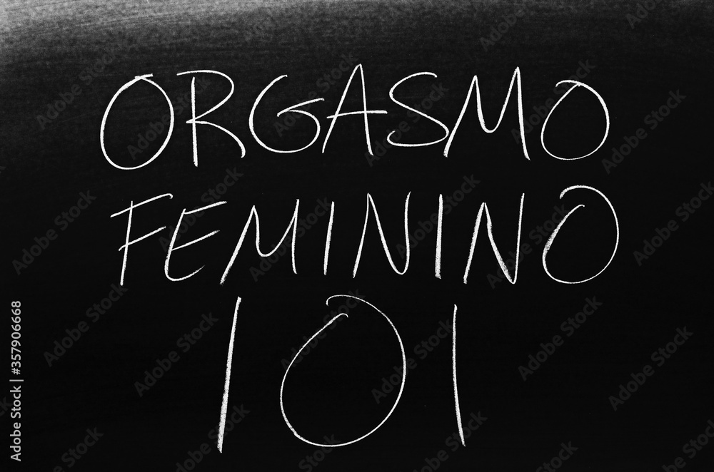 The words Orgasmo Femenino 101 on a blackboard in chalk. Translation Female Orgasm 101 Stock