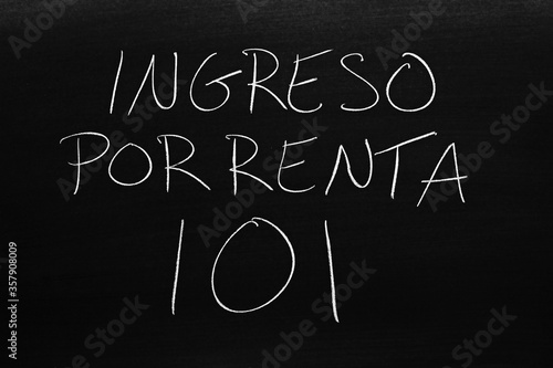 The words Ingreso Por Renta 101 on a blackboard in chalk.  Translation: Rental Income 101 photo