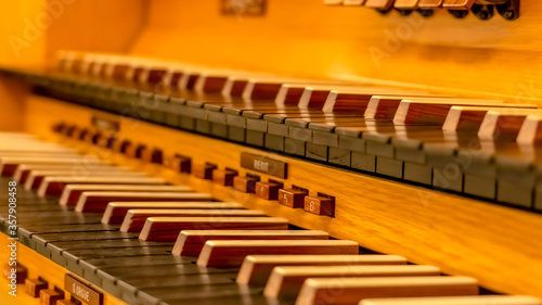 Panorama frame Close up of a beautiful piano with wooden keyboard and protective case