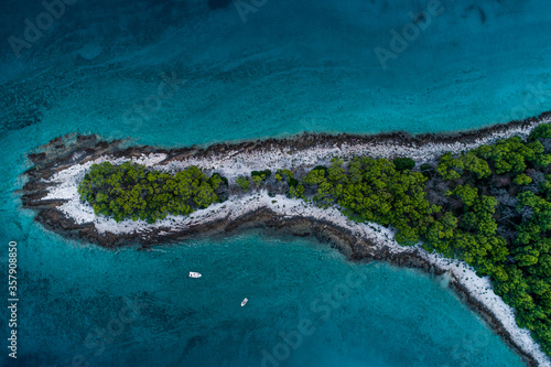Drone top down view of a island surrounded by water