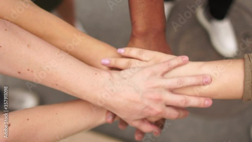 Crossed palms of people of different nationalities, different skin colors as a sign of support and solidarity of the movement against racism and violence. Black lives are important, BLM movement photo