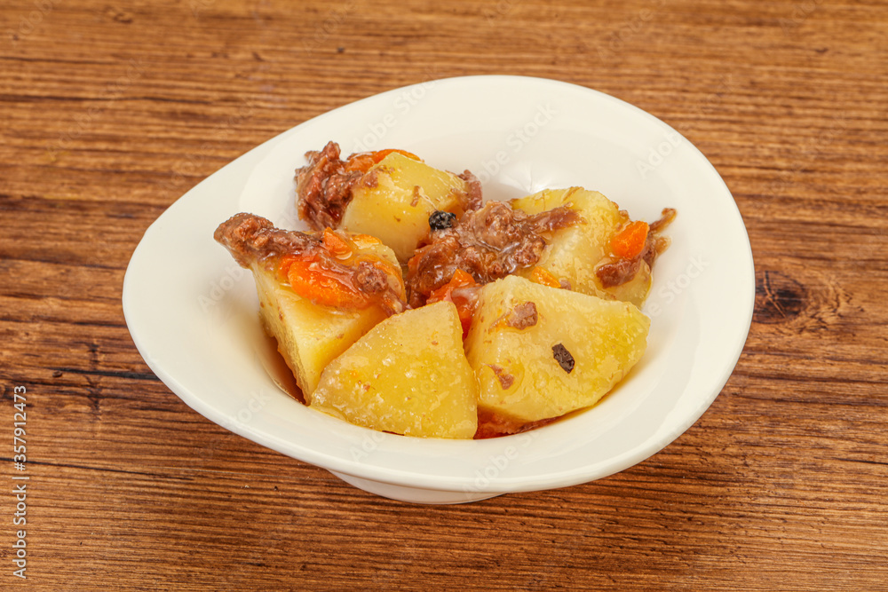 Roasted potato and beef with sauce Roasted potato and beef with sauce