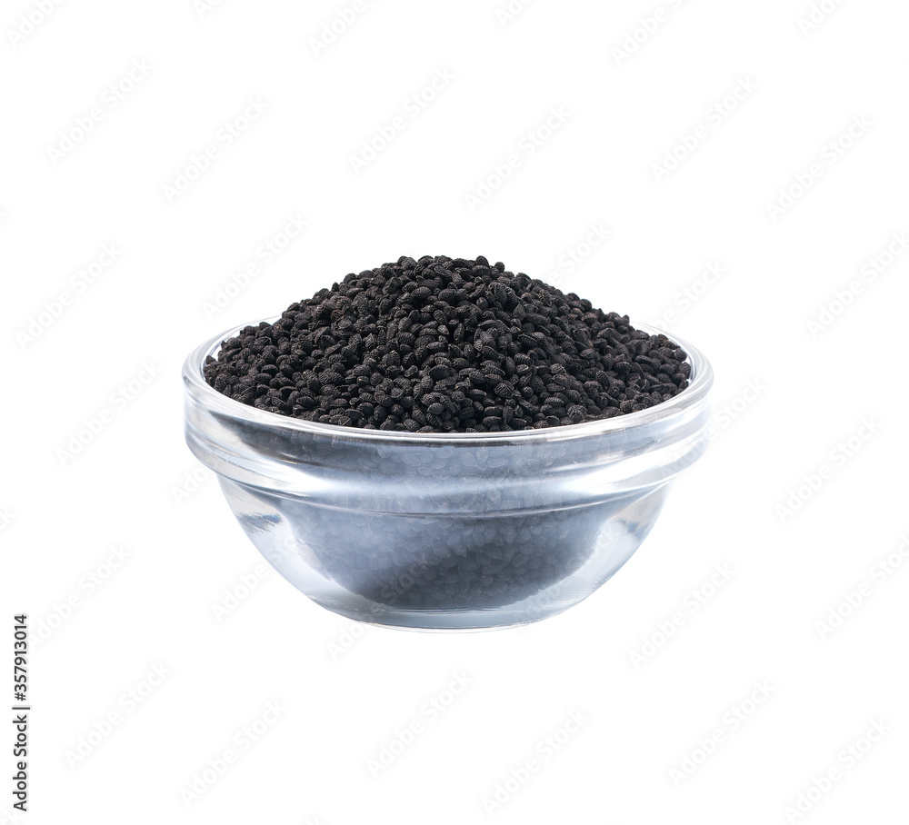 black caraway in a small transparent glass bowl isolated on a white background. black caraway in a small transparent glass bowl isolated on a white background.