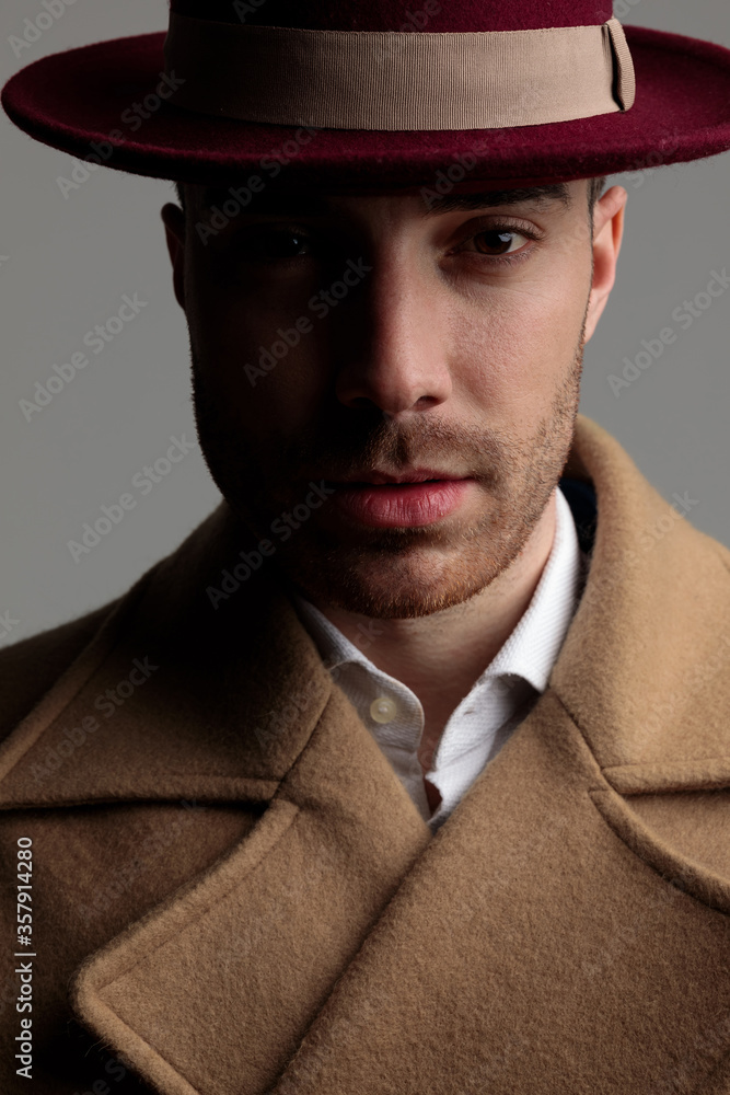 mysterious young guy wearing long coat and hat mysterious young guy wearing long coat and hat