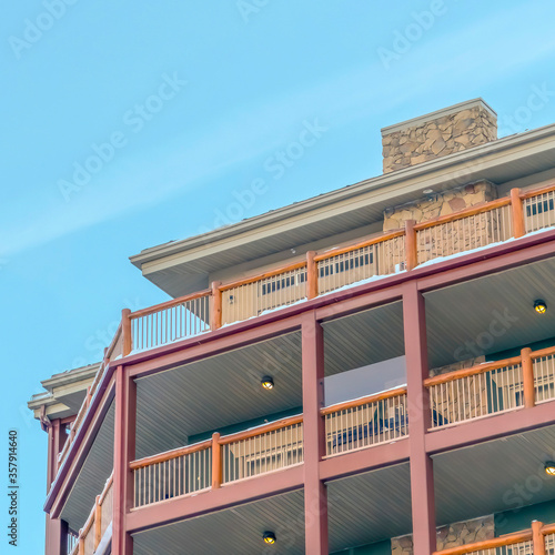 Square frame Snow on the roof and balconies of a residential building on a sunny winter day