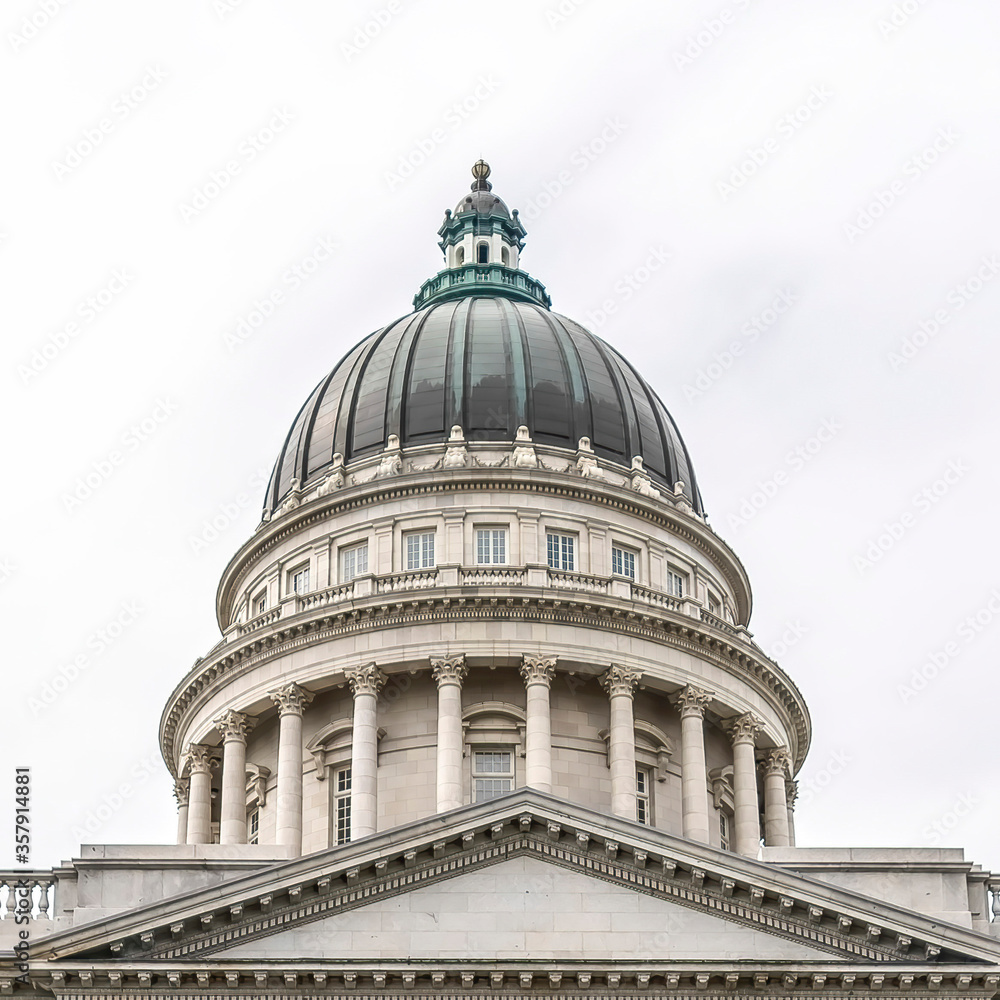 Square Circular pool and fountain with Utah State Capital dome and pedimented building