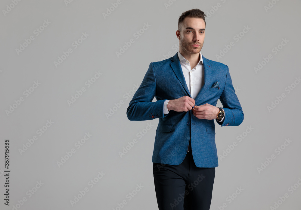attractive young model arranging coat and walking attractive young model arranging coat and walking