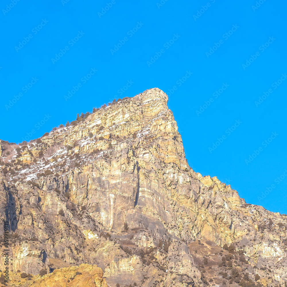 Square frame Steep peak and rocky slopes of a mountain in Provo Canyon Utah on a sunny day Square frame Steep peak and rocky slopes of a mountain in Provo Canyon Utah on a sunny day