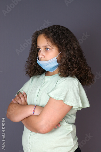 Annoyed girl waiting wearing mask