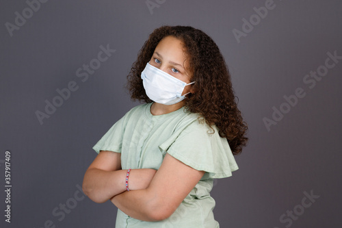Annoyed girl waiting wearing mask