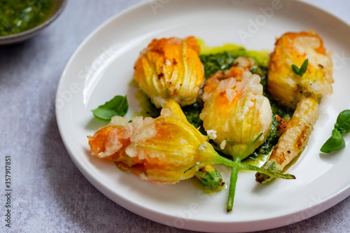 Fényképezés Fried courgette flowers stuffed with ricotta cheese in light tempura batter