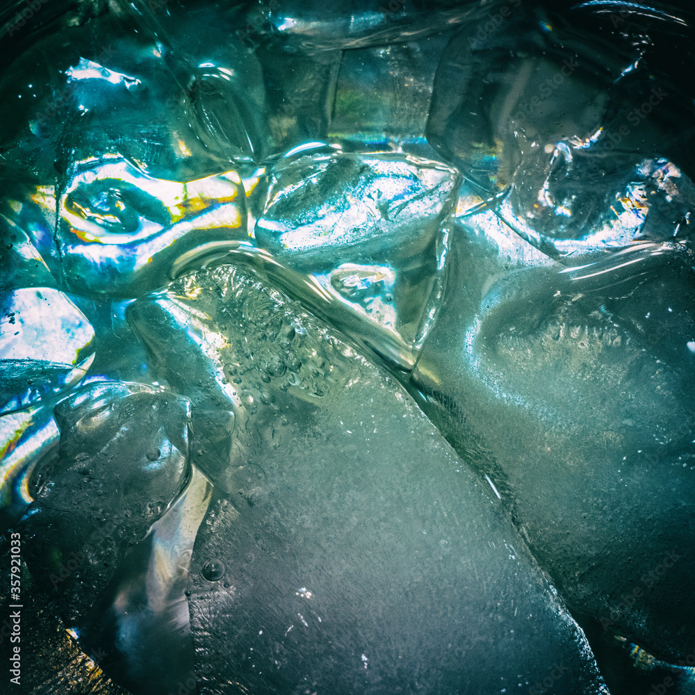 icy surface unevenly frozen blue colors shiny in the sun blurred image