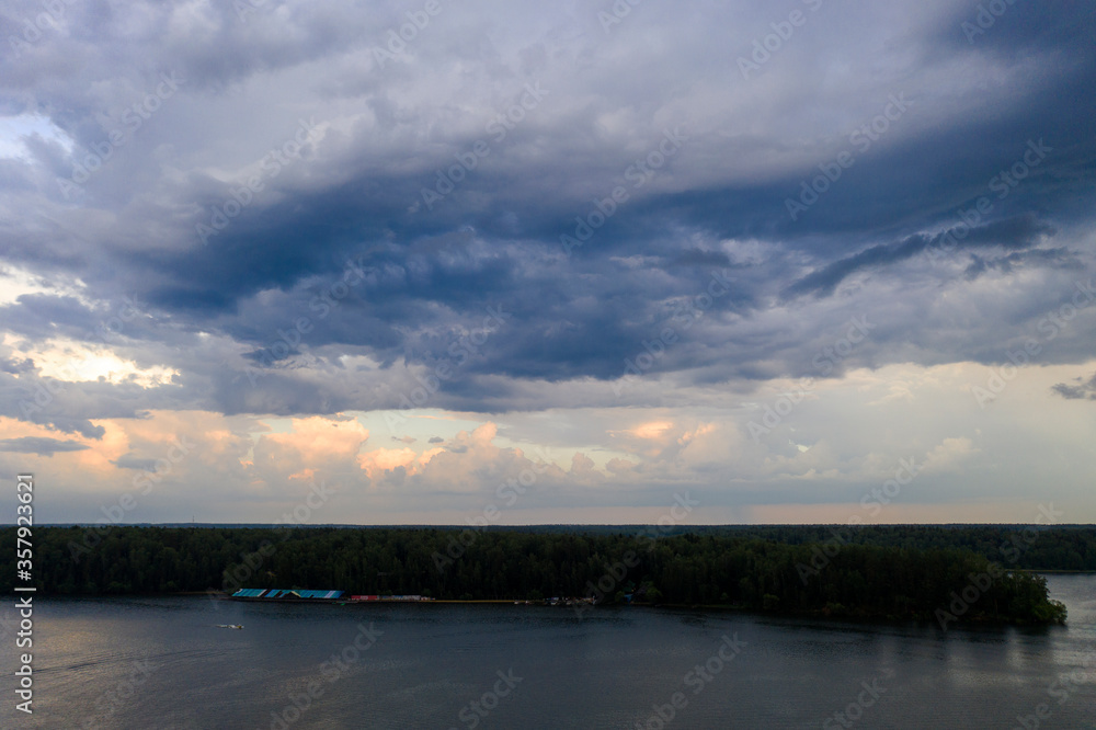 panoramic view of the river with floating boats and beautiful clouds shot from a drone