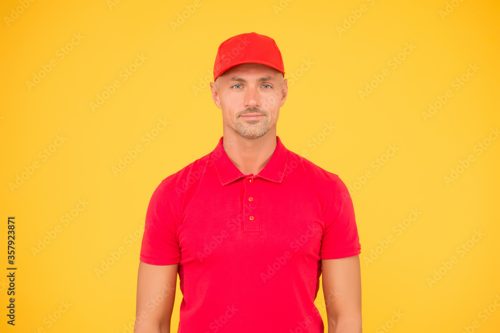 Cool and stylish. Hipster yellow background. Handsome man in trendy hipster style. Unshaven hipster wear red baseball cap. Hipster lifestyle. Fashion and style. Casual trend