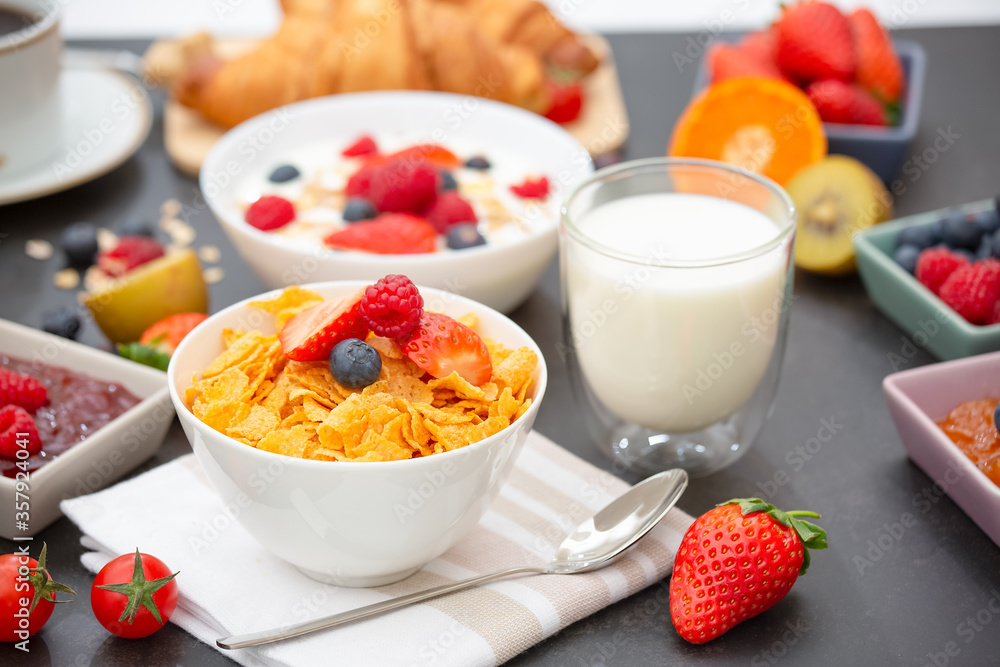 Breakfast Served in the morning with Coffee, Butter croissant and corn flakes Whole grains and raisins with milk in cups and Strawberry, Raspberry, Kiwi, Fresh Orange Juice on the breakfast table. Breakfast Served in the morning with Coffee, Butter croissant and corn flakes Whole grains and raisins with milk in cups and Strawberry, Raspberry, Kiwi, Fresh Orange Juice on the breakfast table.