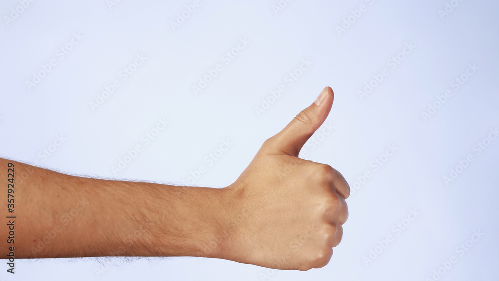 close up cropped man hand showing thumb up gesture sign isolated on white background in studio close up cropped man hand showing thumb up gesture sign isolated on white background in studio