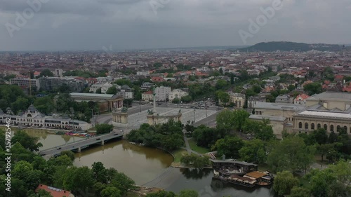 Beautiful views of Heroes' Square and the Andrassy Street behind it. In front of it is the city park and boating. Tourist attraction without tourists in the coronavirus period. Drone recording.