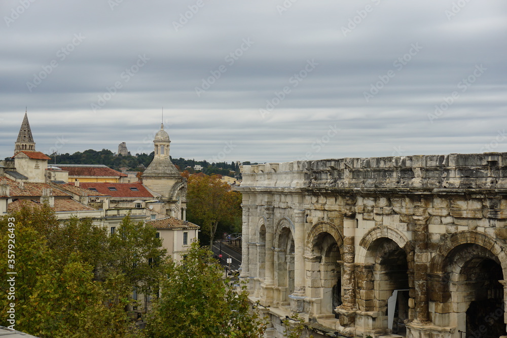 the view from the roof of the Musee de la Romanite to Arenes de Nimes in Occitanie in the month of November, France