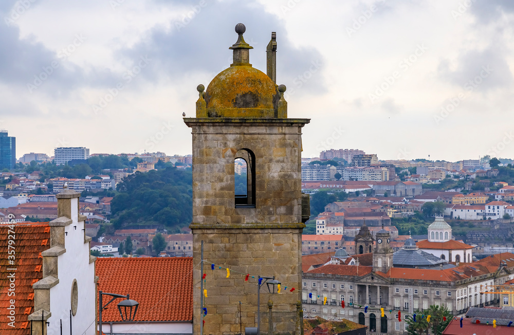 View of Porto Cathedral or Se Catedral and terracotta roofs of the Ribeira and Vila Nova de Gaia in Porto, Portugal