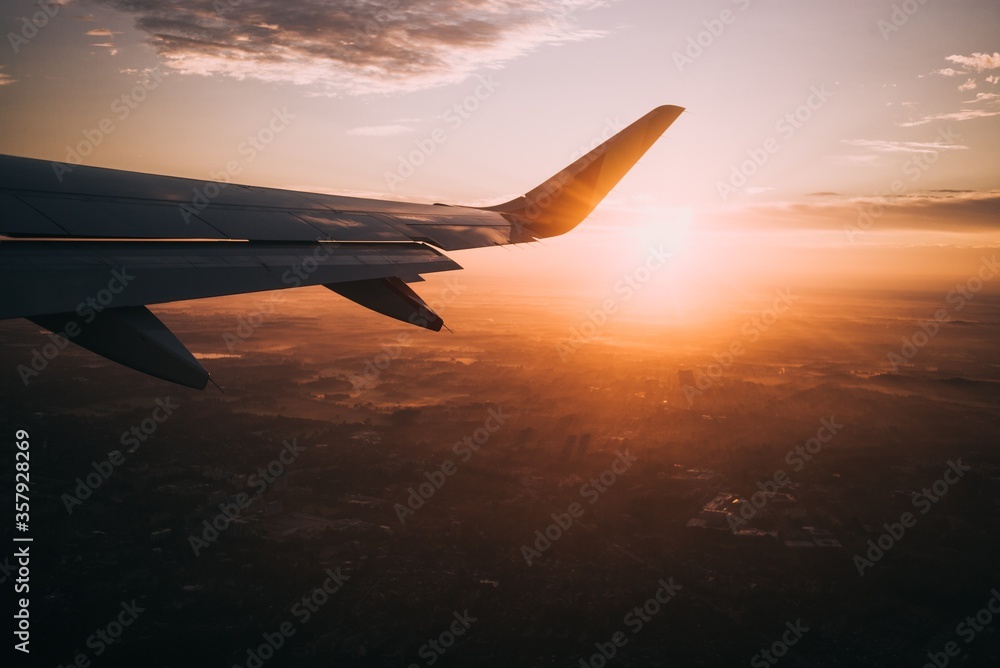 Fototapeta premium airplane in the sky at sunset
