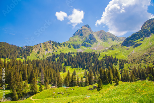 Landscape view of Gantrischseeli at the Switzerland nature park, Natural scenery with a river in the middle between the mountains. On a clear day in the summer sky, for travel and holiday vacations.