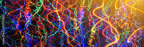 Defocused colorful abstract lights background. Motion of blur light. Nice background on the theme of disco, pop, trance music and art.