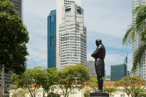 Statue of Sir Stamford Raffles standing tall at Boat Quay in Singapore photo