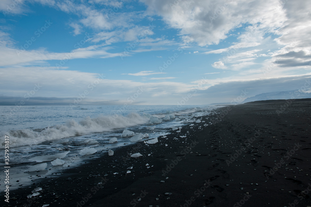 small pieces of ice at volcano black beach iceland