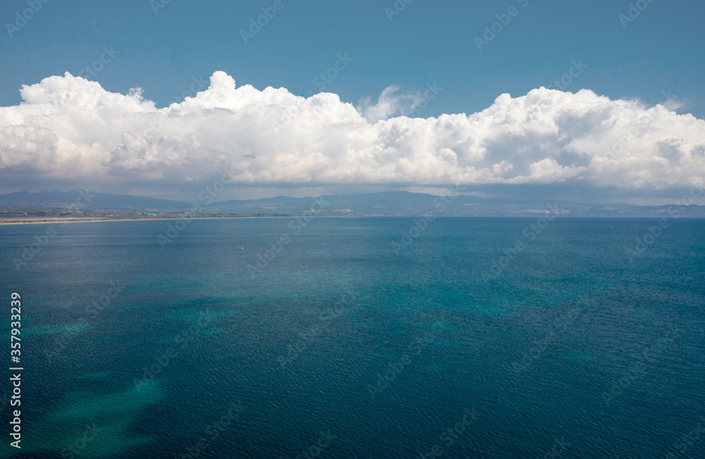 Aerial view at blue sea with beautiful cloudscape