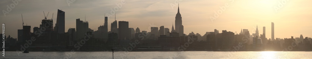 Panoramic sunrise view of Manhattan skyline from Hoboken. New York. USA.