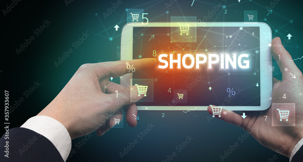 Close-up of a hand holding tablet with PREORDER inscription, online shopping concept Close-up of a hand holding tablet with PREORDER inscription, online shopping concept