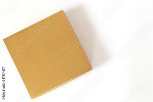 Golden square box isolated on white background.