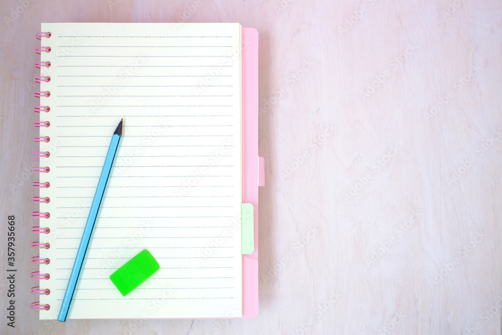 Empty notebook paper for text with blue pencil Empty notebook paper for text with blue pencil