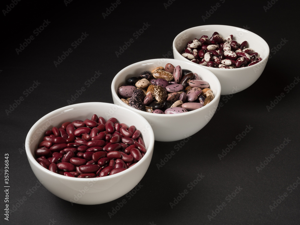 Organic beans and legumes on a black background. Organic beans and legumes on a black background.