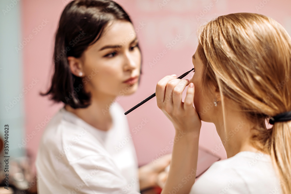 Make-up artist at work at a fashion show Make-up artist at work at a fashion show