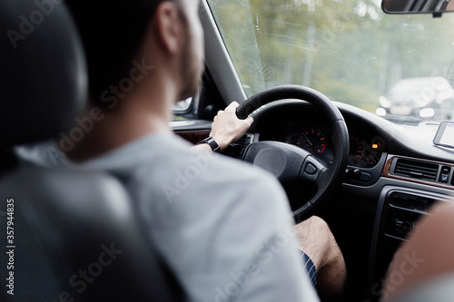 male driver on a summer day trip.