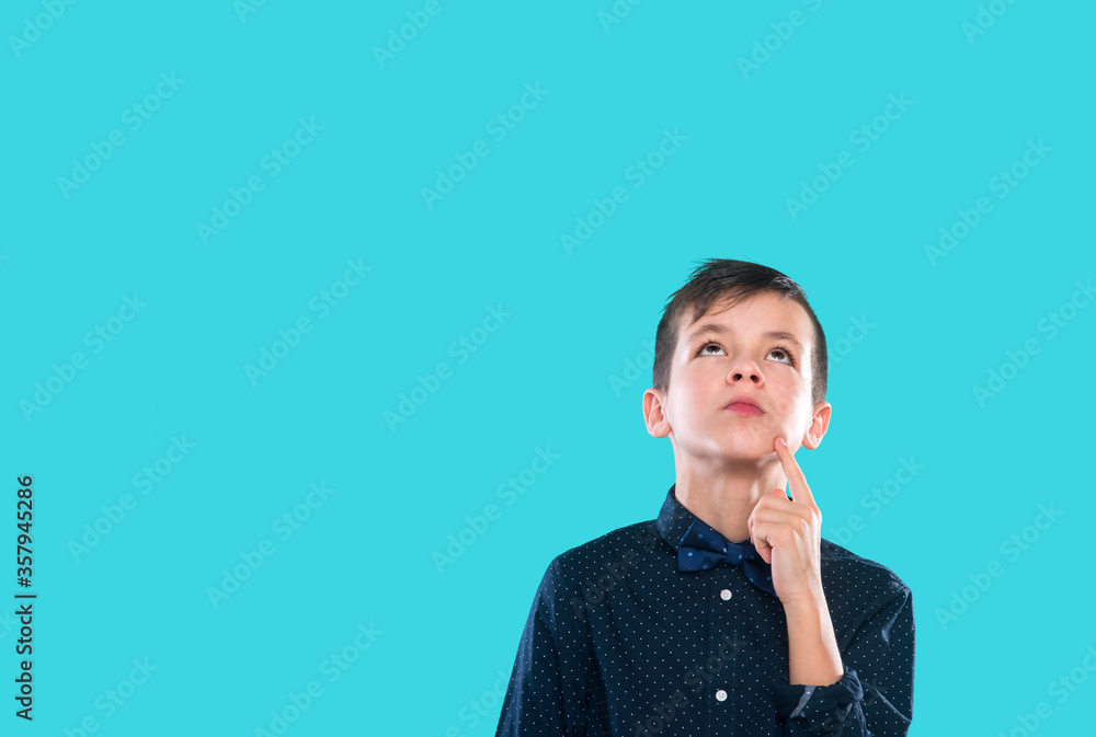 Thoughtful Handsome Young Teenage Boy On Blue Background Thoughtful Handsome Young Teenage Boy On Blue Background