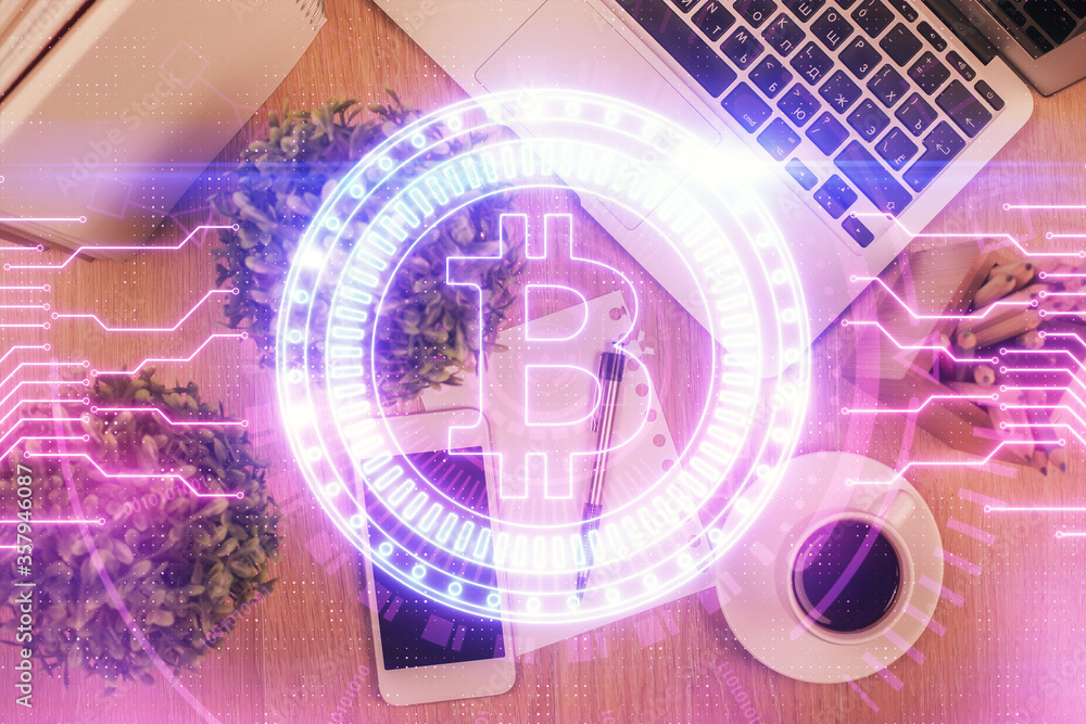 Double exposure of blockchain theme hologram over table with phone. Top view. Crypto technology concept. Double exposure of blockchain theme hologram over table with phone. Top view. Crypto technology concept.
